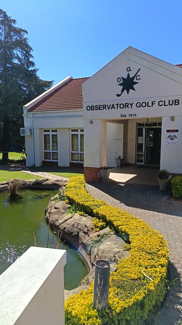 Observatory Golf Club entrance with Est. 1914 signage and koi pond