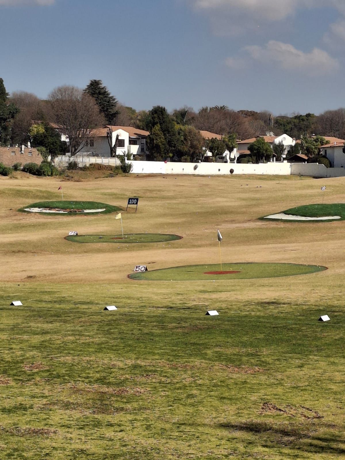 Driving range target greens at 50, 75 and 100 metres